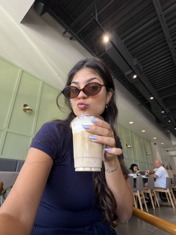 Bea enjoying an iced coffee